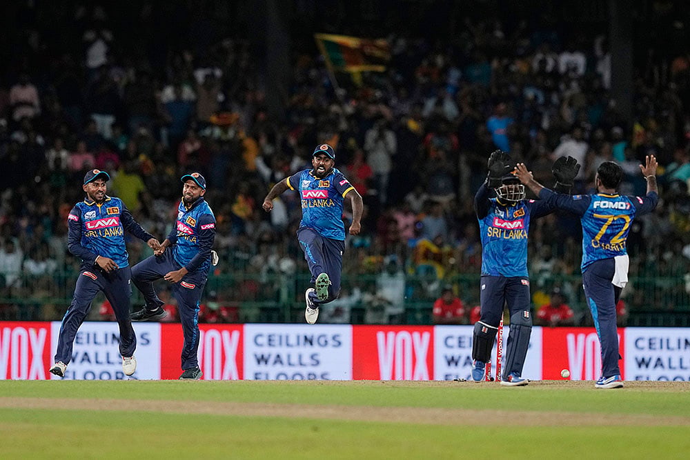 | Photo: AP/Eranga Jayawardena : Sri Lankan players celebrate their win over India in 2nd ODI cricket
